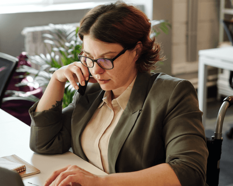 Entrepreneur at a desk choosing a new online business tool