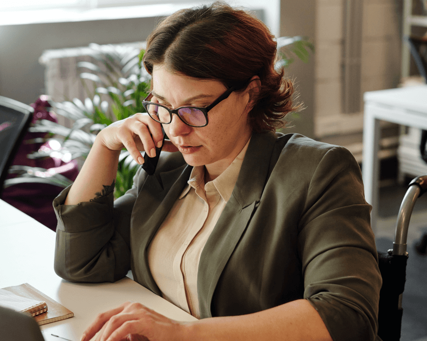 Entrepreneur at a desk choosing a new online business tool